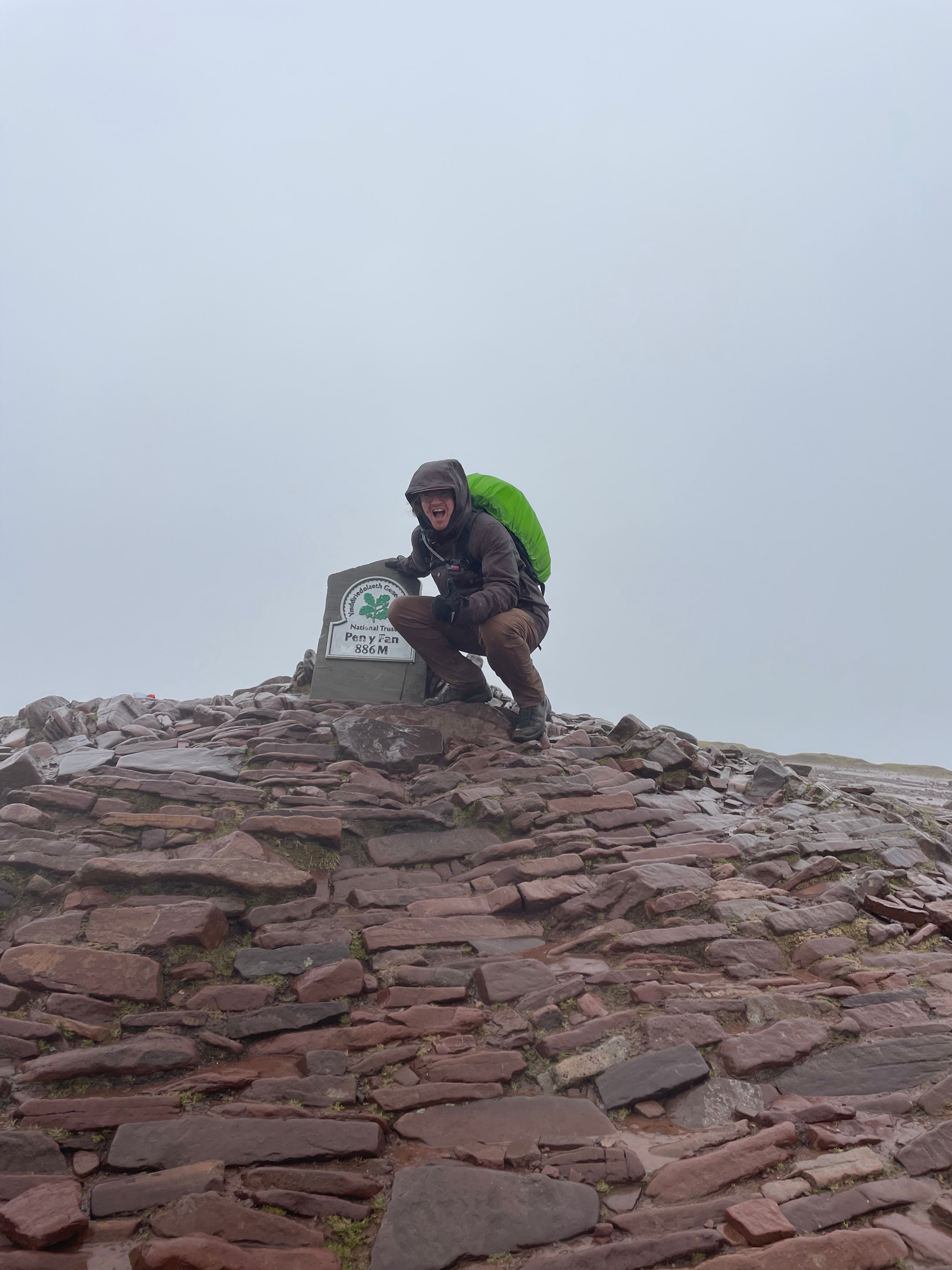 Photo of a man in a room using a tablet computer